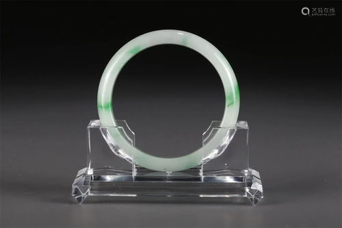 A JADEITE BANGLE.