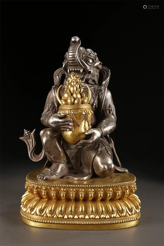 A TIBETAN SILVER DHARMAPALAS BUDDHA STATUE.