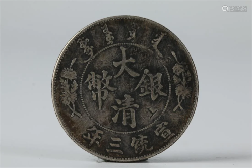 AN ONE-YUAN SILVER COIN, QING DYNASTY.