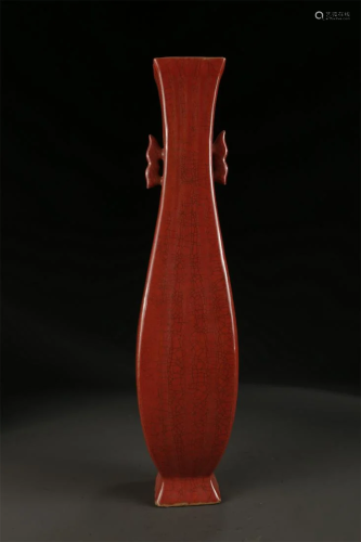 A RED GLAZED PORCELAIN BOTTLE WITH TWO EARS.