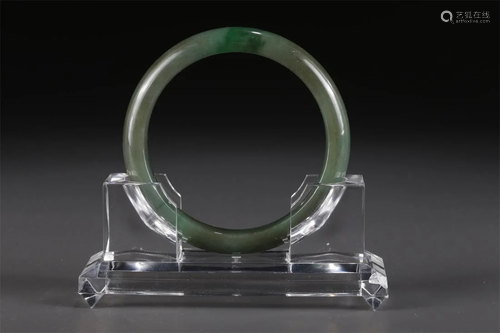 A JADEITE BANGLE.