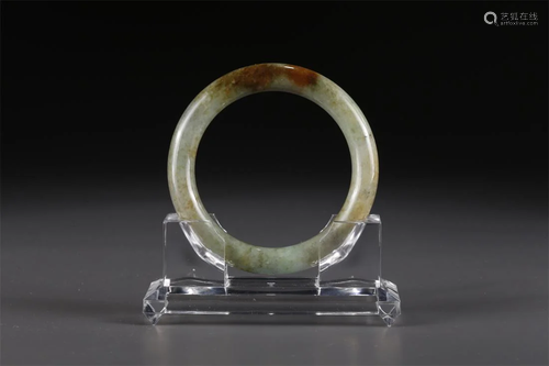 A JADEITE BANGLE.