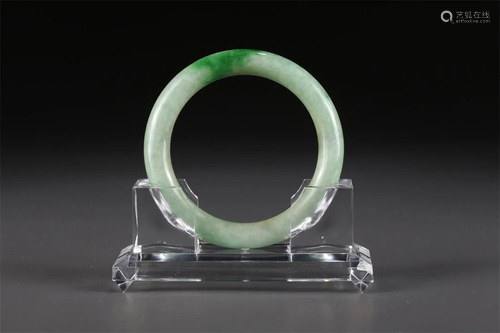 A JADEITE BANGLE.