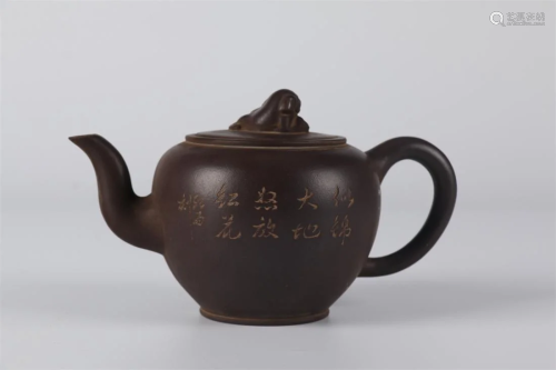 A PURPLE CLAY TEAPOT WITH PLUM BLOSSOMS DESIGN.