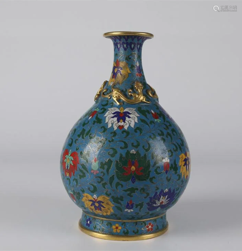 A GILT CLOISONNE DISPLAY VASE.