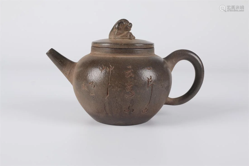 A PURPLE CLAY ROUND TEAPOT.