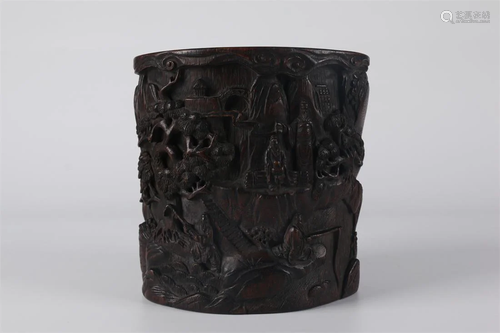 A NARRA WOOD BRUSH POT WITH FIGURE DESIGN.