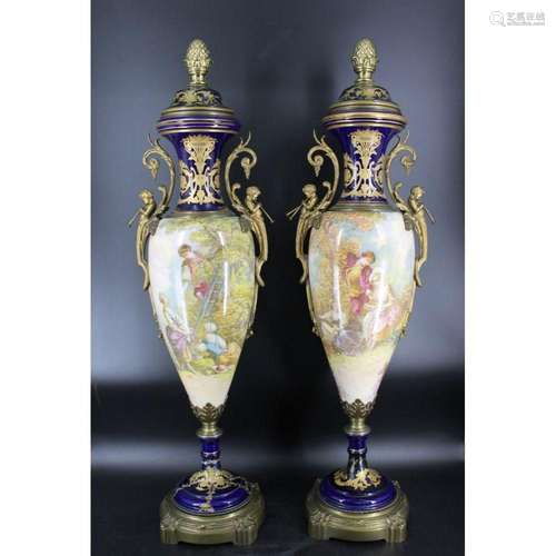 A Pair Of Palace Size Sevres Porcelain Urns.