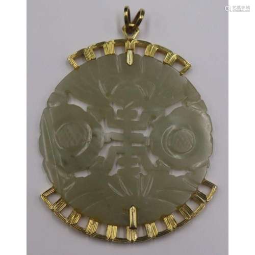 JEWELRY. Large 14kt Gold and Carved Jade Pendant.