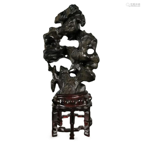 A CHINESE TAIHU SCHOLAR'S STONE ON STAND