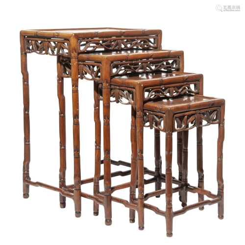 A SET OF CHINESE HARDWOOD NESTING TABLES