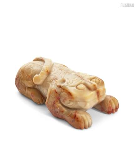 A BEIGE AND RUSSET JADE CARVING OF A BEAST CHINA, MING DYNAS...