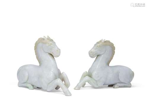 A PAIR OF JADEITE FIGURES OF RECUMBENT HORSES CHINA, 20TH CE...