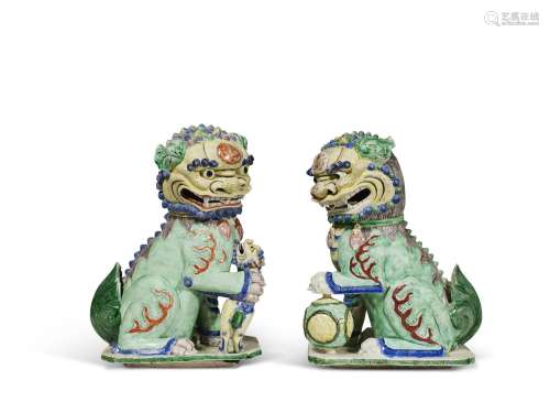 A PAIR OF FAMILLE VERTE BUDDHIST LIONS CHINA, QING DYNASTY, ...