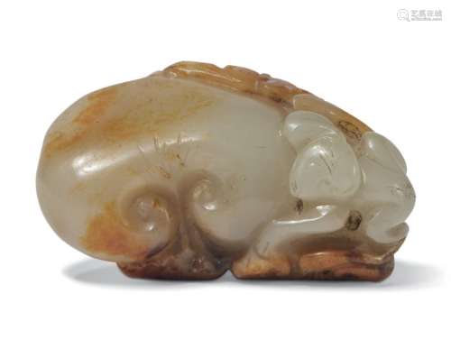 A PALE CELADON AND RUSSET JADE 'MONKEY AND PEACH' GROUP CHIN...