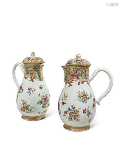 A LARGE PAIR OF FAMILLE ROSE AND GILT-DECORATED JUGS AND COV...