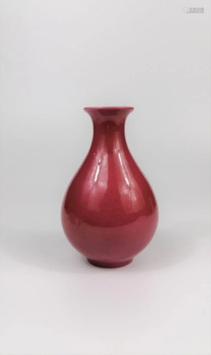 A Chinese carmine red Yuhuchun vase bottle