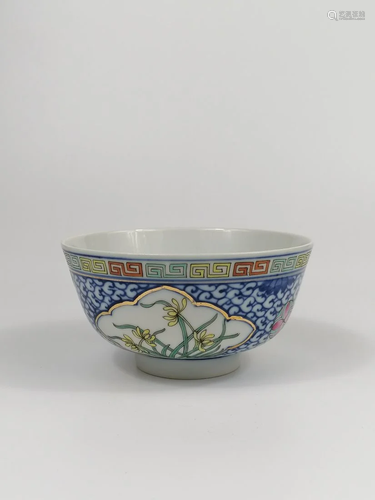 A Chinese blue white and famille rose bowl