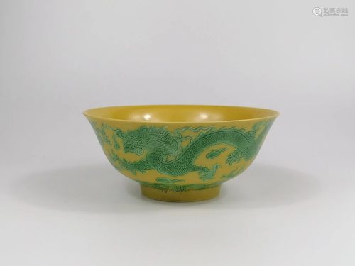 A Chinese porcelain Green enamelled yellow ground dragon bow...