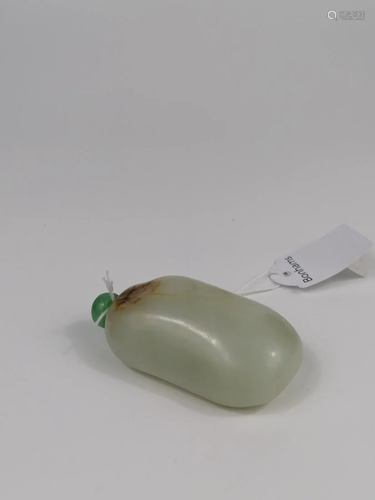 A PALE GREEN AND RUSSET JADE 'PEBBLE' SNUFF BOTTLE