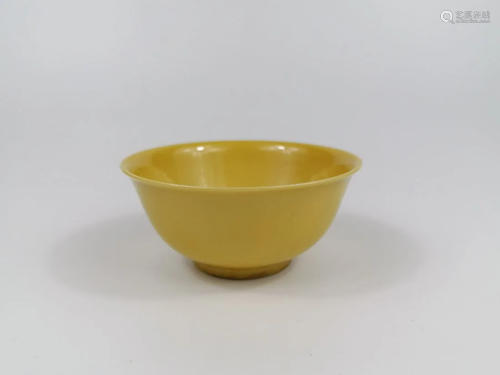 A Lemon-yellow enamelled bowl