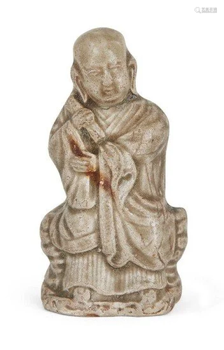 A Small rare Yaozhou Celadon Figure of a Seated Monk