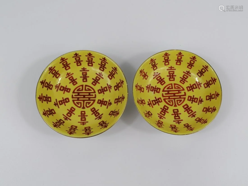 A Pair of Chinese yellow ground iron red inscribed saucers