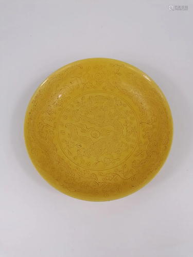 A Chinese yellow glazed dragon dish