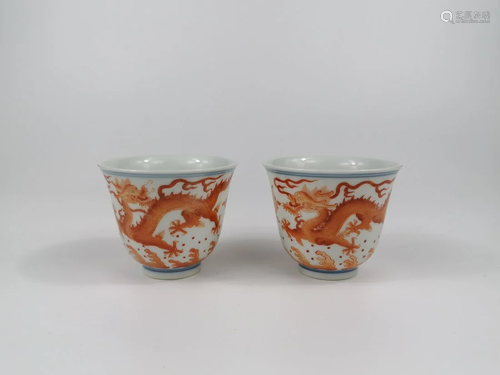 A PAIR OF IRON-RED 'DRAGON' WINE CUPS