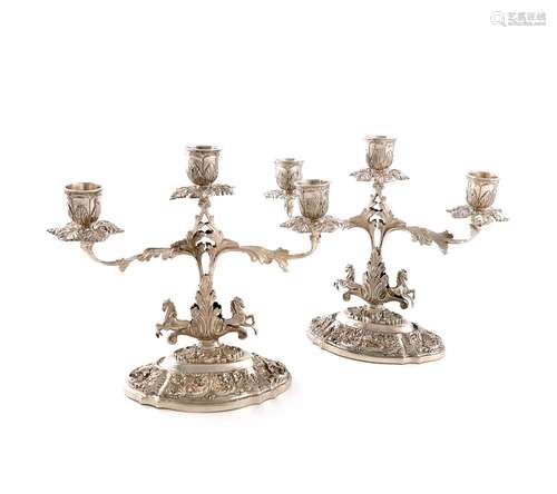 A pair of continental silver three-light candelabra, unmarke...