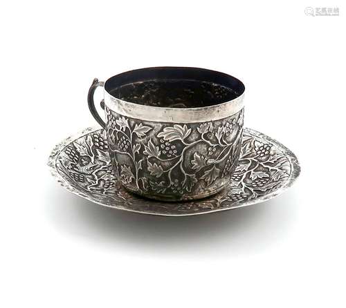 A late 19th century Indian silver cup and saucer, unmarked, ...