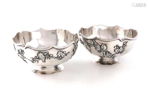 A pair of Chinese silver bowls, marked with Chinese characte...