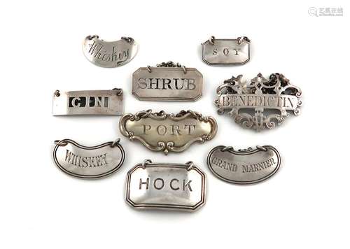 A collection of silver wine labels, various dates and makers...