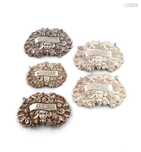 A collection of five early 19th century silver wine labels, ...