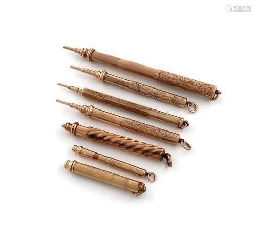 A collection of seven gilt-metal propelling pencils, one dou...