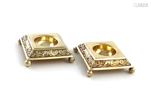 A pair of Victorian silver-gilt salt cellars, by I S Greenbe...