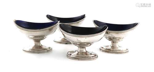 A set of four George III silver salt cellars, over-stamped w...