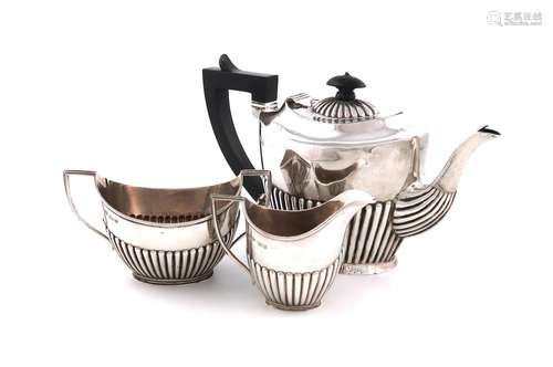 A matched three-piece late-Victorian silver tea set, teapot ...