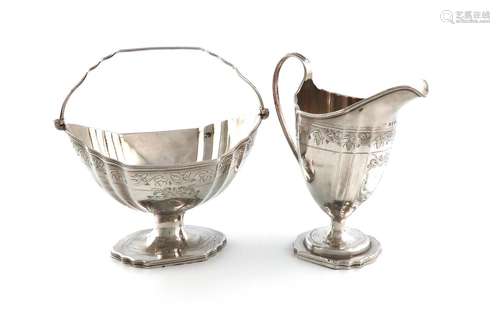 A George III silver swing-handled sugar basket and cream jug...