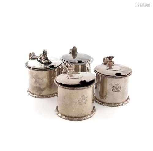 A collection of four Victorian Regimental silver mustard pot...