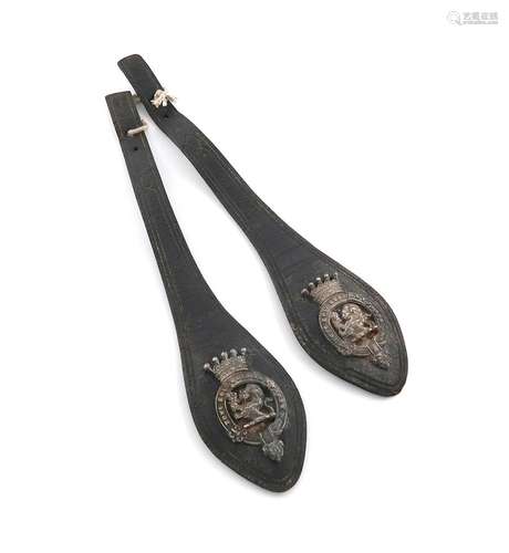 Two silver badges mounted on leather straps, unmarked, the b...