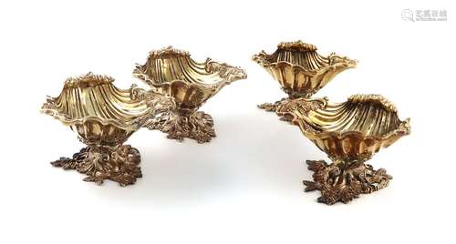 A matched set of four modern cast silver-gilt salt cellars, ...