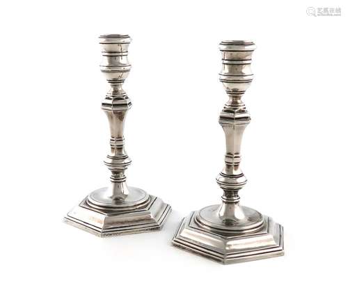 A pair of cast silver candlesticks, by R. Comyns, London 195...