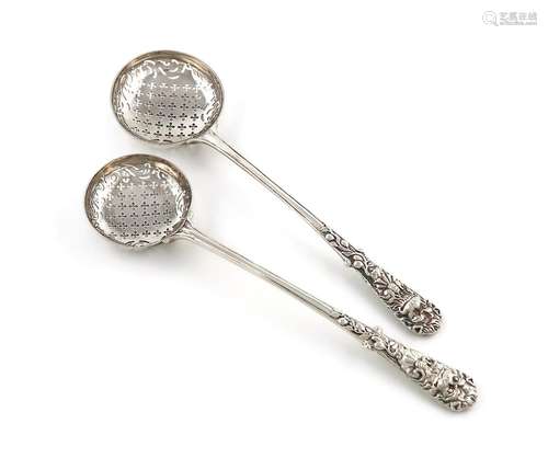 A graduated pair of George II silver sifting spoons, probabl...