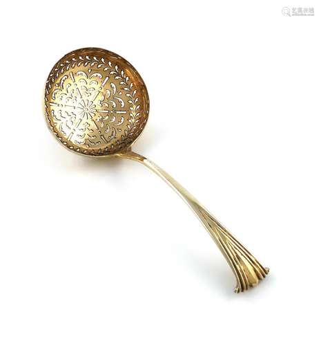 A George III silver-gilt Onslow pattern sugar sifting spoon,...