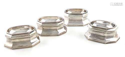 A set of four George I silver trencher salt cellars, by Jame...