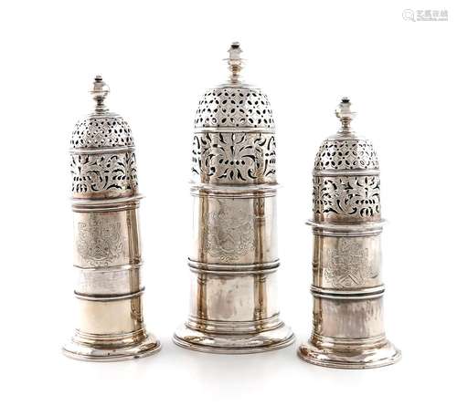 A suite of three Queen Anne silver sugar casters, by Charles...