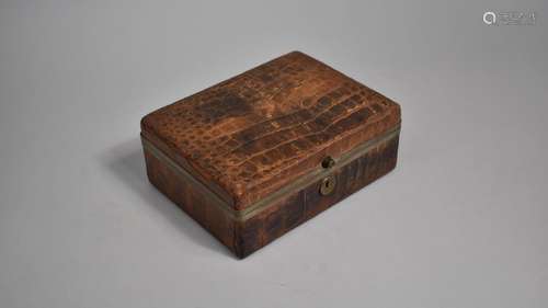 An Early 20th Century Crocodile Skin Travel Case with Fitted...