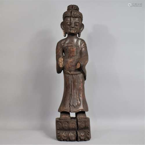 A 19th Century Burmese Carved Teak Standing Buddha Supported...