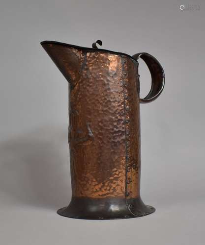 A Large Arts and Crafts Hammered Copper Lidded Jug by Willia...